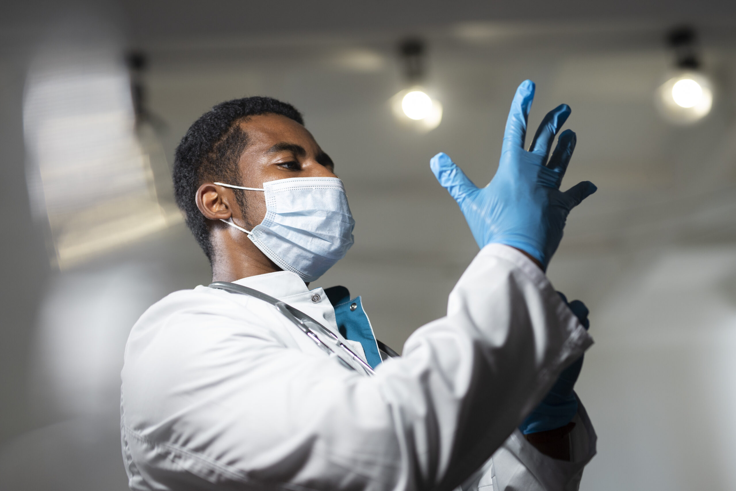 medium-shot-doctor-putting-gloves